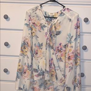 Umgee floral sheer wrap top with crisscrossed tie.